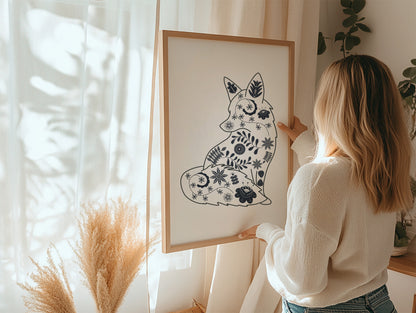 woman holding framed print of scandinavian fox